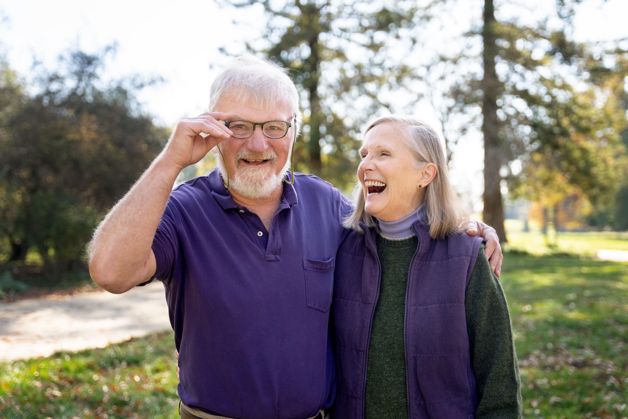 Chris and Christy Dewees laughing in the Arboretum.