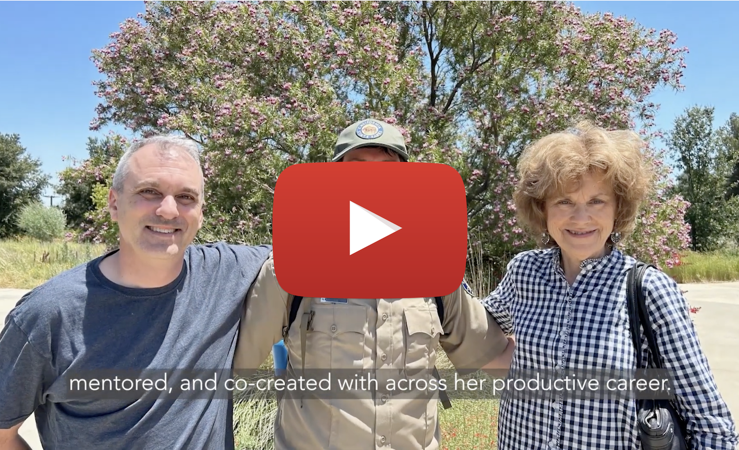 YouTube play button over a still from a video featuring Kathleen Socolofsky