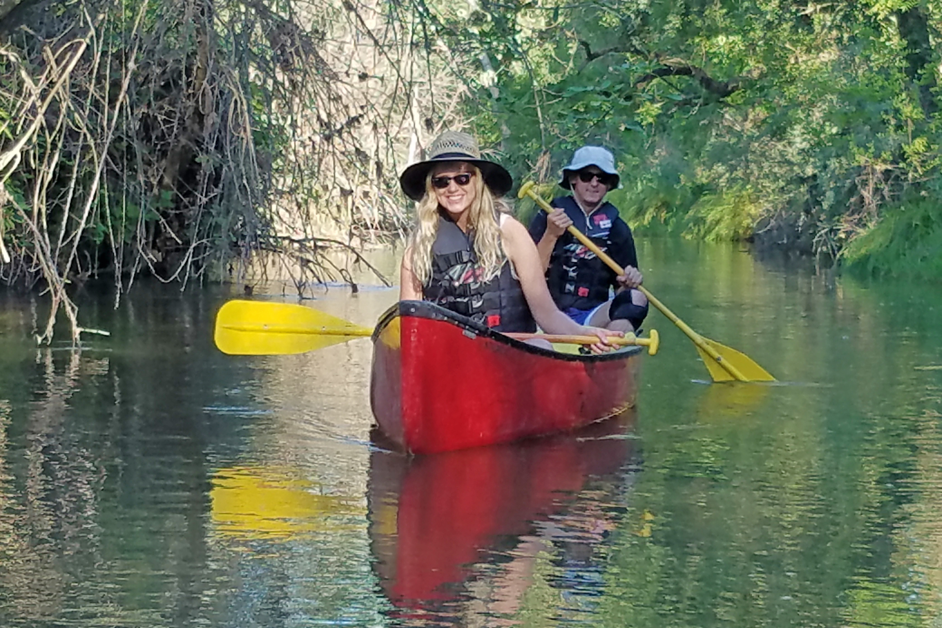 Students canoeing in Putah Creek