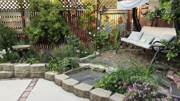 Tucker Backyard after renovation with outdoor swinging seat area