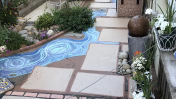 Tucker Backyard after renovation with tiling and plants
