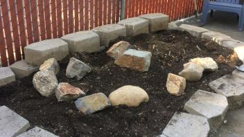 Tucker Backyard during renovation setting up rocks and soil arrangement