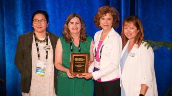 Tracy Qiu, Carmia Feldman, Kathleen Socolofsky, and Michelle Provasnik pose with APGA award plaque