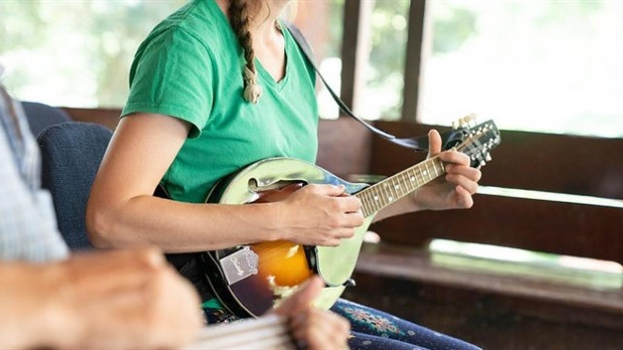 Woman playing mandolin