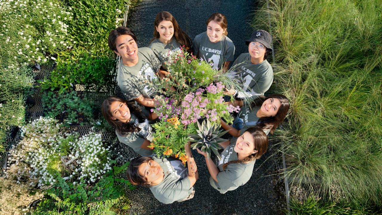 Student interns pose with plants in the Arboretum Teaching Nursery
