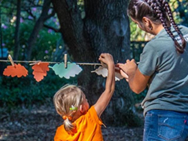 volunteer and child at the uc davis oaks forever event