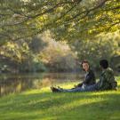 Image of students relaxing in the Arboretum.
