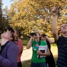 Group of people with binoculars in the Arboretum