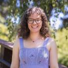 Elena smiles in the UC Davis Arboretum