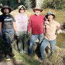 a group of volunteers in the UC Davis Arboretum Waterway.