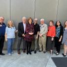 Group of people, including Arboretum staff and donors, stand posing for a picture