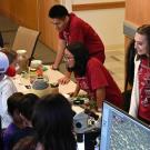 Visitors look over nematode display at the 2024 Biodiversity Museum Day