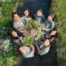 Student interns pose with plants in the Arboretum Teaching Nursery