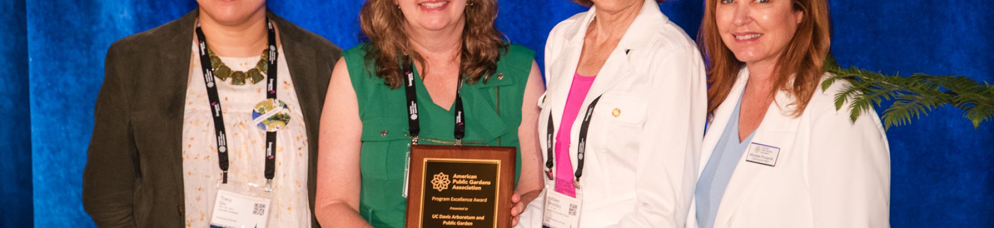 Tracy Qiu, Carmia Feldman, Kathleen Socolofsky, and Michelle Provasnik pose with APGA award plaque